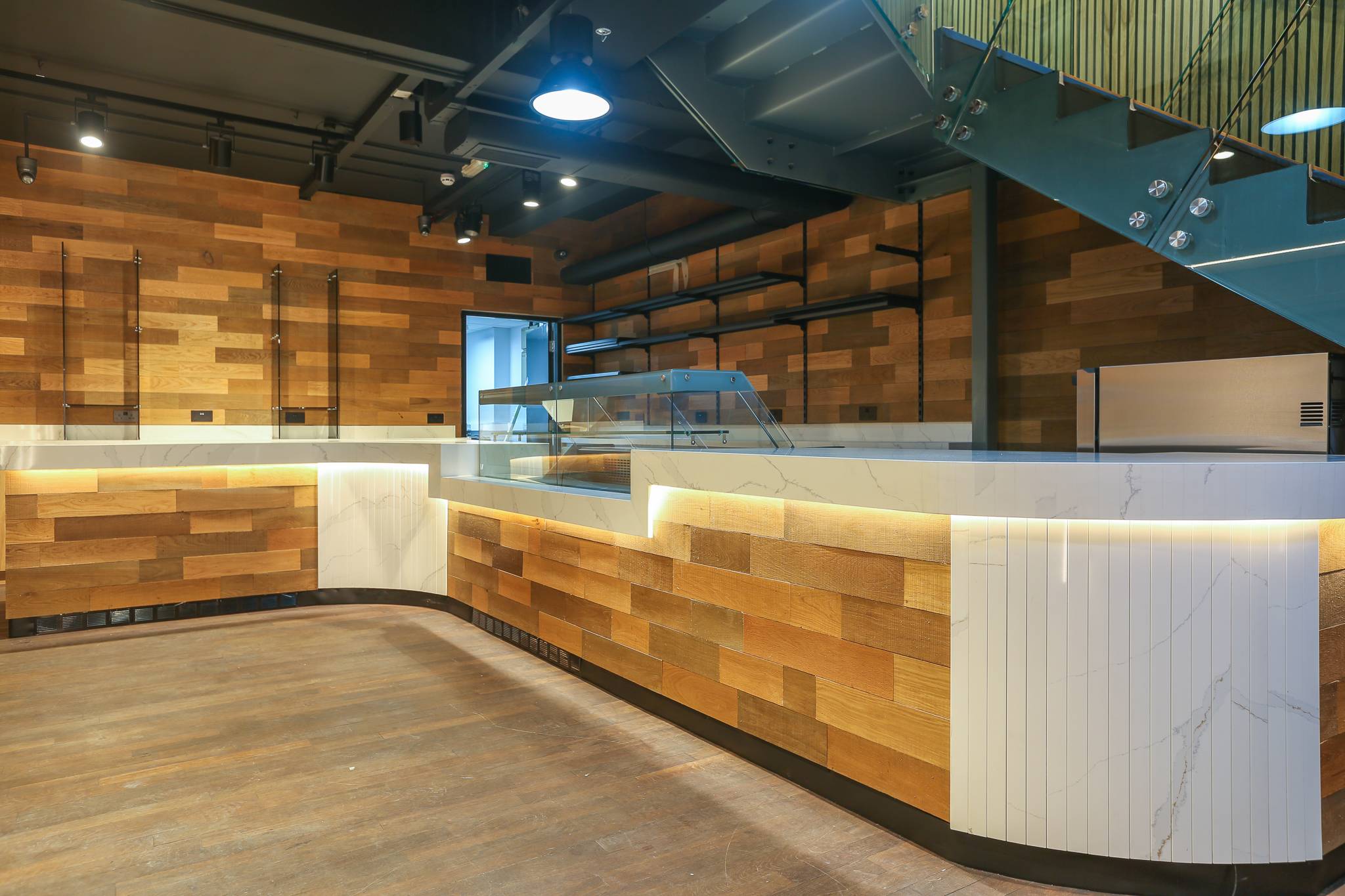 Al Dimashqi shop in Kensington with curved timber counters and lit display units